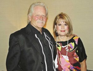 Bob and Dale Ann Clore standing next to each other smiling.