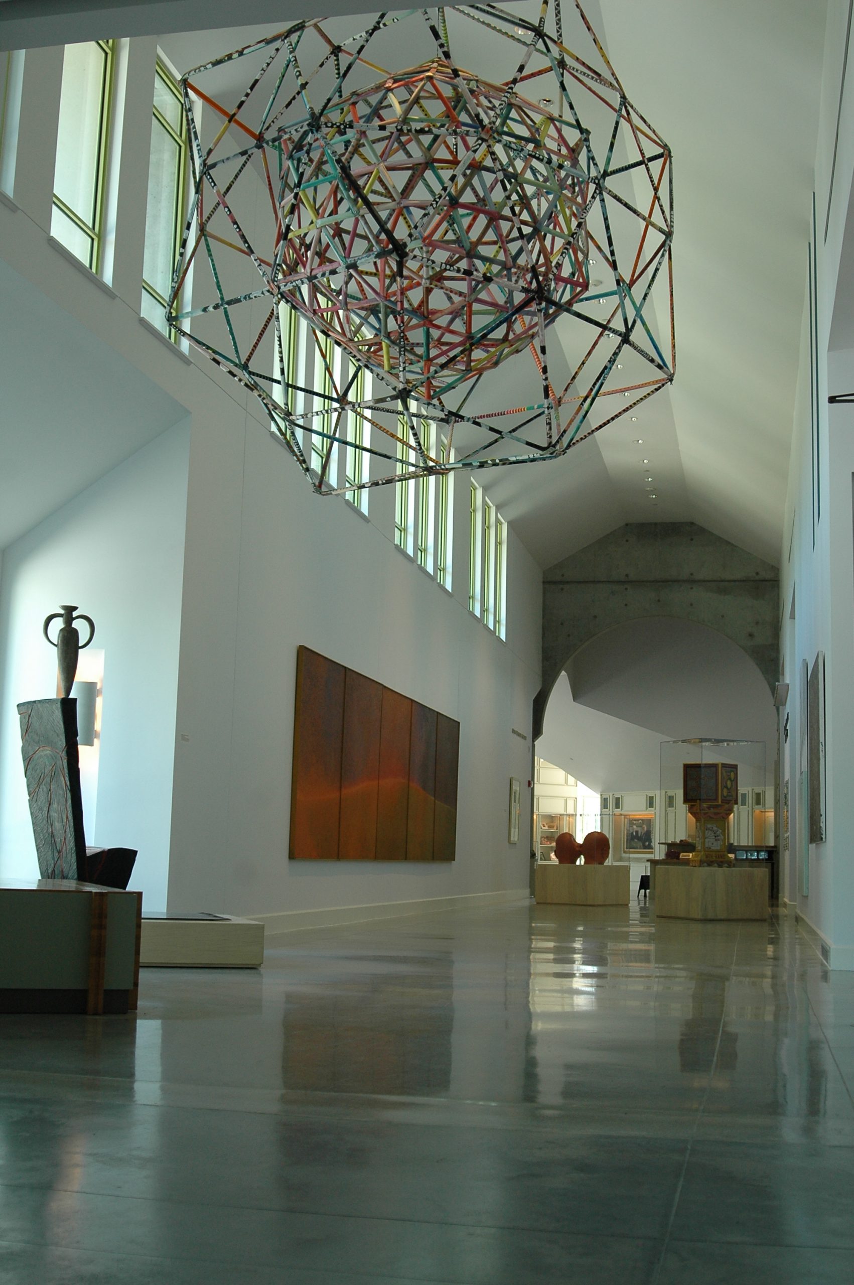 Art installations within the Hempler Gallery corridor, featuring "Kansas Meatball" by Alan Shields, and "?" by Wendell Castle.