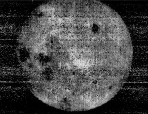Grainy, black and white photo from 1959 of the far side of the moon.