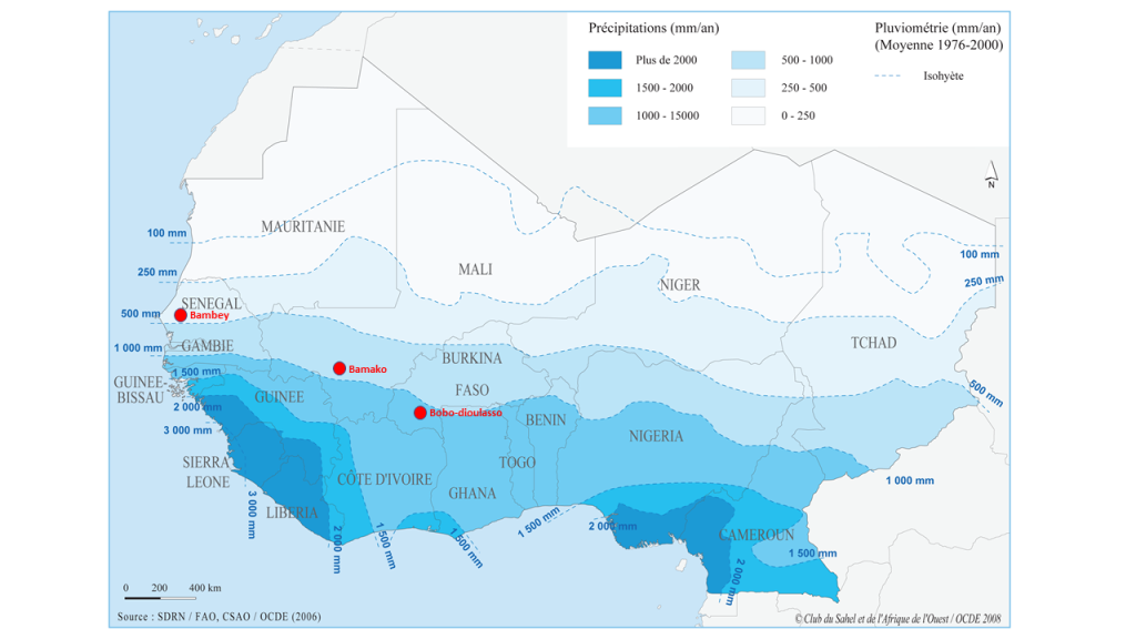 Geographic map of West Africa showing Regional Isohyets Mapping & Possible Location of High Throughput Phenotyping Hubs in Bambey, Bamako, Bobo Dioulasso. Color coded with dark blue showing most precipitation in Sierra Leone, Liberia, South Nigeria, West Cameroun and least amount in North Mauritanie, Mali, Niger, Chad.