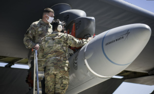 Figure 11-14: Crew members from the 912th Aircraft Maintenance Squadron secure the AGM-183A Air-launched Rapid Response Weapon Instrumented Measurement Vehicle 2 as it is loaded under the wing of a B-52H Stratofortress during a hypersonic test, Edwards Air Force Base, Calif., Aug. 6, 2020. (Source: Space.com | Image Credit: USAF/Giancarlo Casem)