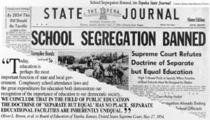 Picture of the front page of the newspaper with the following headline: School Segregation Banned.