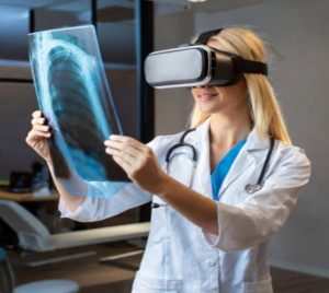 Figure 3-2 Nurse Reviewing Chest Xray To Project On 3-D VR Image For Details