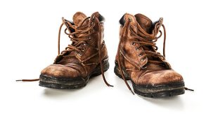 Two old, worn-out work boots