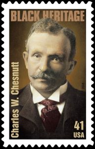 The image shows the Charles W. Chesnut Black Heritage stamp. The stamp is a sepia toned image of Charles Chesnut.