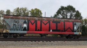 Graffiti on train in Manhattan, Kansas, which reads, "No More Stolen Sisters. M.M.I.W."