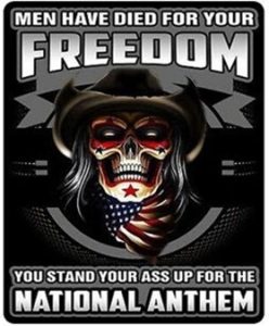 Bumper sticker that shows a scary skull in the middle. The skull's eye sockets are red, there's a red star on its chin and blue stars under its eye sockets. The skull is wearing a tattered cowboy hat and an American flag neckerchief. The overall background is black and gray and looks like it might be the barrel of a gun pointing at the viewer. The text reads "MEN HAVE DIED FOR YOUR FREEDOM. YOU STAND YOUR ASS UP FOR THE